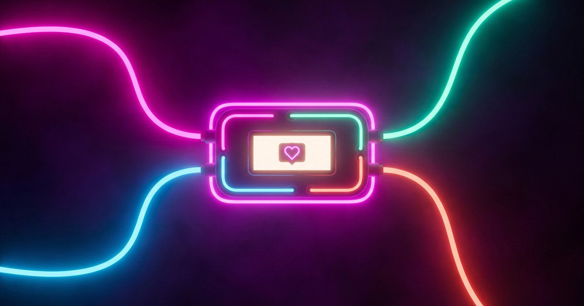 An ESP32 badge with a small OLED display showing a pulsing heart